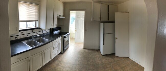 Full pantry in kitchen with laundry hook ups in next room - 1665 Sycamore St