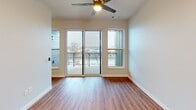This 460 square foot apartment in New London, Wisconsin, offers a thoughtfully designed living space that maximizes efficiency and comfort. The open-concept floor plan seamlessly integrates the kitchen and living area, creating a sense of spaciousness within the compact footprint. 

The kitchen is a highlight, featuring light wood cabinetry, stainless steel appliances, and a sleek subway tile backsplash. Modern amenities include a full-size refrigerator, built-in microwave, and electric range, catering to all culinary needs.

The living area boasts warm wood-look flooring that extends throughout the apartment, enhancing the cohesive design. Large windows and a sliding glass door lead to a private balcony, flooding the space with natural light and offering picturesque views of the surroundings.

The bathroom is well-appointed with a single vanity, ample storage, and neutral tones that complement the overall aesthetic. Recessed lighting throughout the apartment adds to the modern ambiance, while a ceiling fan in the main living area ensures comfort.

Despite its modest size, the apartment's clever layout and contemporary finishes create a stylish and functional living environment, perfect for those seeking a low-maintenance lifestyle in a prime location.