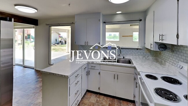 Building Photo - $500 Rent Credit | Spacious 4-bedroom home...