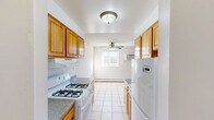 Located at 1717 Bath Rd in Bristol, PA, this single-floor, two-bedroom, one-bathroom residence offers a practical and well-organized layout. The galley-style kitchen flows directly into the dining area and is equipped with warm honey-toned wood cabinetry, a gas range, a refrigerator, a sink, and tile flooring. A ceiling fan in the adjacent dining space adds comfort, while a window brings in natural light and views of the surrounding greenery. The living room features light hardwood-style flooring and baseboard heating, creating a clean and comfortable atmosphere. Both bedrooms are well-proportioned, with the primary bedroom offering a generous footprint, hardwood-style flooring, a wide window with outdoor views, and baseboard heating. Each bedroom includes closet space, and the home features a total of three closets for ample storage. The bathroom includes a tub/shower combination with neutral tile surround. Hallways connect the rooms efficiently, contributing to the home's functional flow. Throughout the residence, light-toned walls and wood-style floors create a consistent, bright aesthetic, while baseboard heating provides warmth across all rooms.