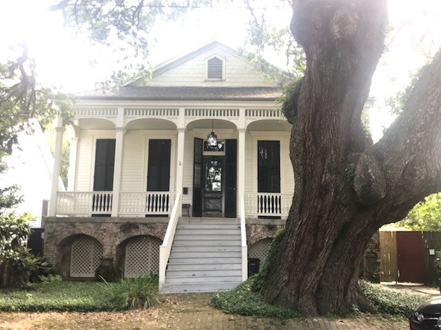 Unit is on right in photo. Two floor to ceiling windows with working shutters - 7809 Dominican St