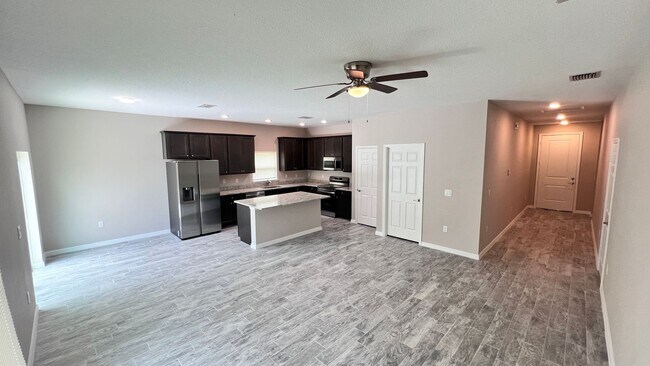 Building Photo - Spacious 3-Bedroom Home with Garage & Pati...