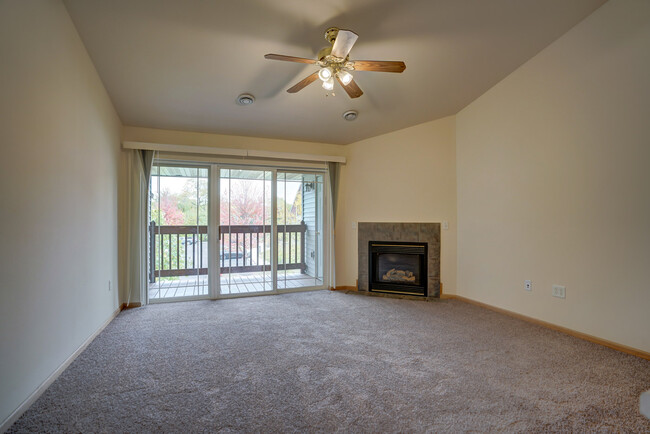 Living Room with Gas Fireplace and walk-out to private deck - 6081 Viroqua Dr