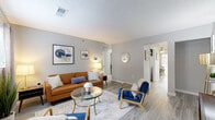 Located in Decatur, GA, this efficiently designed 2-bedroom, 2-bathroom single-story home offers a well-organized layout that includes a living room, dining room, kitchen, dedicated office, hallway, utility room, and closet. Throughout the home, light gray walls and wood-look flooring create a cohesive, contemporary aesthetic.

The living room is an inviting space with a textured ceiling, neutral tones, and an open sightline connecting to the hallway and dining area. The kitchen features crisp white cabinetry, granite-style countertops, and a full suite of stainless steel appliances, including a range, microwave, dishwasher, and refrigerator. Adjacent to the kitchen, the dining area benefits from a sliding glass door that brings in natural light and outdoor views.

The primary bedroom offers a comfortable retreat with a ceiling fan, natural light from a window with sheer curtains, and a closet with louvered bi-fold doors and built-in shelving. The office includes a ceiling fan, natural light, and ample space for a full desk setup. Both bathrooms are cleanly finished, each with a tub-shower combination, white vanity, and wood-look flooring. A utility room provides practical in-unit support space, completing this functional and well-appointed home.