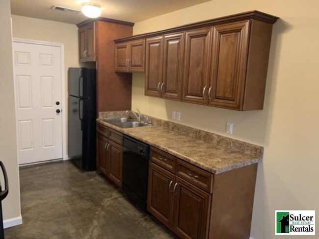 Building Photo - The Oaks - Water &amp; Sewer Included