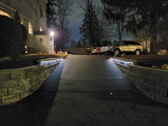 The driveway is well illuminated at night. - 116 Fairview Ave