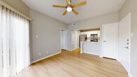 Located at 9833 N MacArthur Blvd in Irving, TX, this one-bedroom, two-bathroom unit offers a thoughtfully designed single-level layout. Light wood-style flooring runs throughout, creating a cohesive and bright atmosphere enhanced by neutral gray walls and crisp white trim. The open-concept living and kitchen area forms the heart of the unit, where a ceiling fan overhead and natural light from windows contribute to an airy feel. The kitchen is outfitted with white shaker-style cabinetry, white quartz countertops, a stainless steel refrigerator, dishwasher, microwave, and range, along with a breakfast bar that connects seamlessly to the living space. The bedroom is a comfortable, quiet retreat with a natural light window and direct access to a walk-in closet featuring multi-tiered shelving. Both bathrooms are finished with white shaker vanities, quartz countertops, and framed mirrors, with one bathroom including a soaking tub. Three closets in total provide generous storage throughout. A private patio extends the living space outdoors. The clean, modern finishes and efficient layout make this unit a well-appointed and functional Irving residence.