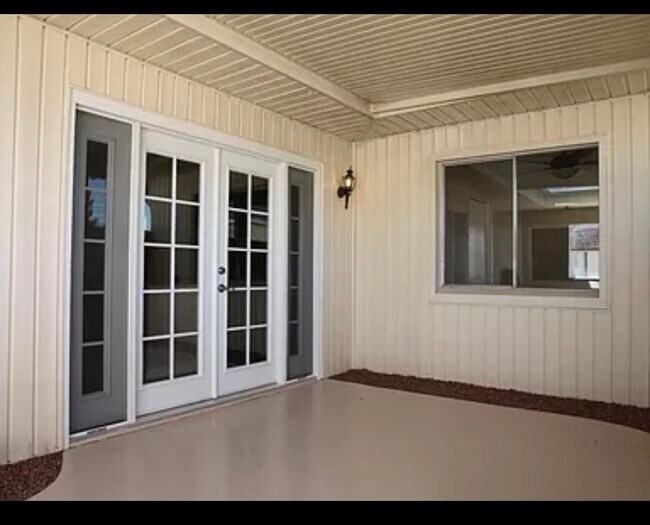 Patio doors lead to carport- plus great lighting without direct sun exposure - 5046 N 83rd St