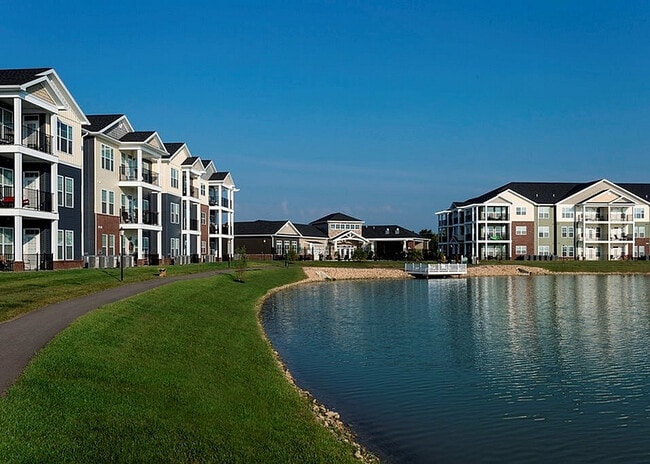 Amenities include a 6-acre lake, fishing deck, and walking trail. - WaterStone at Green River
