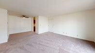 Located at 2805 W Larchmont Ln in Peoria, Illinois, this single-floor, 3-bedroom, 1-bathroom home offers a practical and comfortable layout. The interior is finished with neutral tones throughout, creating a clean and versatile canvas.

The living area is generously proportioned, featuring soft carpeting, a ceiling fan, and sliding glass doors that open onto a private balcony — allowing natural light to fill the space and providing outdoor views. The layout flows easily into the kitchen area, which features darker cabinetry for a subtle contrast to the otherwise light color palette.

The primary bedroom is notably expansive, offering ample space for furnishings, along with a closet and direct access to the shared bathroom. The two additional bedrooms are well-sized, each with carpeted floors and windows that bring in natural light and neighborhood views, making them well-suited for various uses.

The single bathroom is thoughtfully laid out, featuring warm wood-tone vinyl flooring, a long vanity with a wide mirror, towel bars, and a bathtub. A hallway connects the bedrooms and provides additional storage via a dedicated closet. Throughout the home, textured ceilings and neutral walls maintain a consistent, understated aesthetic.