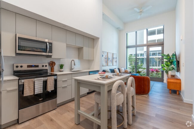 1BR, 1BA - 649SF - Kitchen/Living Room - The Tropic Apartments