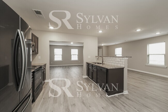 Foto del edificio - Come view this charming home