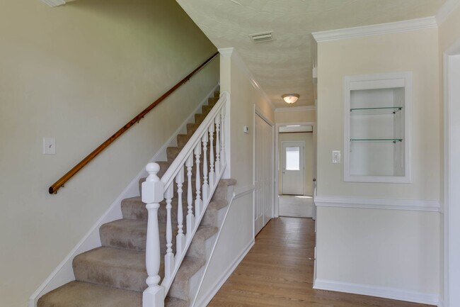 Formal Foyer with Lighted Curio Cabinet - 1325 Kasba Ct