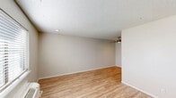Located at 608 Black Oak Ave in Springdale, Arkansas, this one-bedroom, one-bathroom unit offers a practical and efficiently arranged single-floor layout. Throughout the space, light wood-style flooring and neutral warm-gray walls create a clean, cohesive aesthetic, complemented by textured ceilings and white baseboards.

The open-concept kitchen and living area serves as the heart of the unit. The kitchen features white shaker-style cabinetry with brushed nickel hardware, light stone countertops, a stainless steel double-basin sink, a dishwasher, and an electric range. The living area flows naturally from the kitchen and includes a ceiling fan, recessed lighting, and ample room for furnishings.

The bedroom is a comfortable size, offering two closets, a window with blinds for natural light, and a wall-mounted PTAC heating and cooling unit. A hallway connects the bedroom to the rest of the unit and leads to the full bathroom, which includes a combined tub/shower with a curtain rod, toilet, and vanity. Additional storage is provided by two closets accessible from the hallway and bedroom. The layout is straightforward and functional, making efficient use of every square foot.