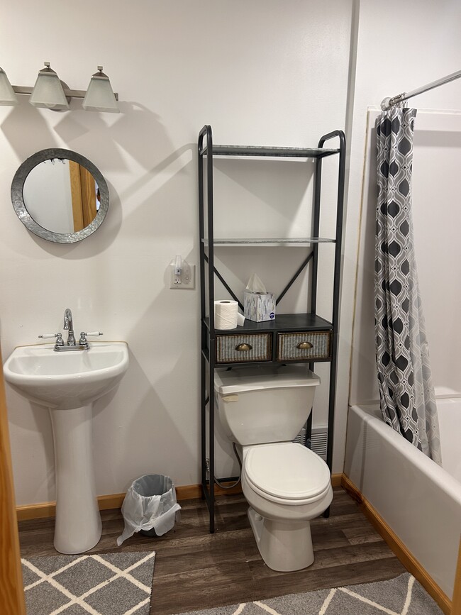 Main floor bathroom with washer and dryer. - 12275 62nd St NE