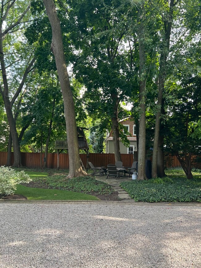 Tenant Patio with table, Adirondack chairs and grill - 1228 Forest Ave
