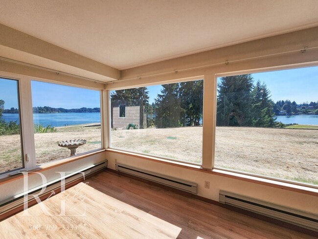 Building Photo - Quiet Living with Panoramic Dyes Inlet Sunset Views