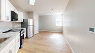 This 480 square foot single-story residence in Akron, OH, offers a well-designed living space with two bedrooms and one bathroom. The home features a neutral color palette with light gray walls and warm wood flooring throughout, creating a cohesive and inviting atmosphere.

The primary bedroom, measuring 120 square feet, provides a cozy retreat with corner windows that allow natural light to flood the space. The second bedroom, while compact, offers versatility as a guest room or home office. Both rooms feature ample closet space with sliding doors for efficient storage.

The kitchen is a standout feature, boasting modern white cabinetry, granite countertops, and stainless steel appliances. A skylight above adds extra brightness to the cooking area. The open concept layout seamlessly connects the kitchen to the living area, maximizing the use of space in this compact home.

The bathroom is efficiently designed with a white color scheme, featuring a tub-shower combination with built-in shelving, a modern toilet, and a vanity with storage. The continuation of wood flooring into this space adds warmth and consistency.

Throughout the home, double-hung windows provide views of the surrounding neighborhood and allow for natural ventilation. The property's efficient use of space and modern amenities make it an ideal option for those seeking a low-maintenance lifestyle or a smart investment opportunity in the Akron area.