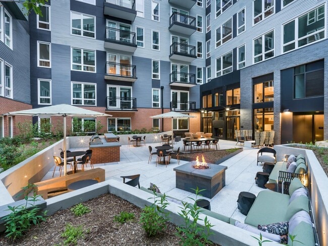 Make the most of every moment in our social courtyard—complete with fire pits, grilling stations, and cozy lounge seating for gathering day or night. - Modera H Street Apartments