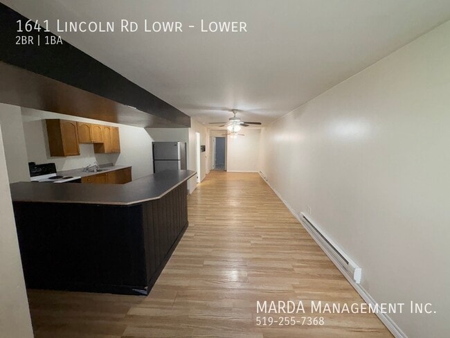 Building Photo - COZY OPEN CONCEPT 2 BED/1 BATH LOWER UNIT - INCLUSIVE!