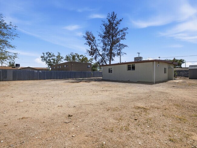 Building Photo - Fully Gated 3-Bedroom Home with Modern Finishes & a private yard!