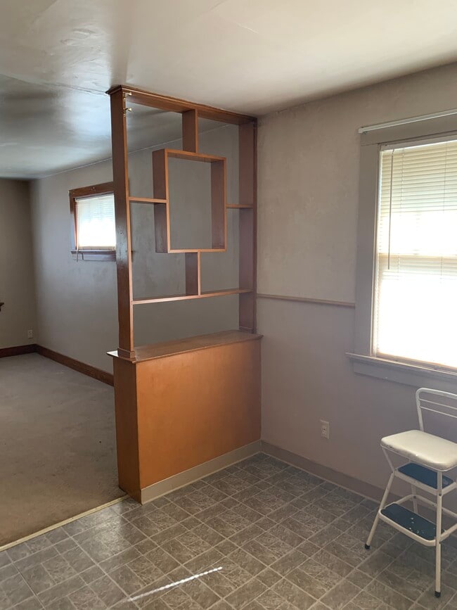 Book shelf divides kitchen and living room - 1626 Kearney Ave