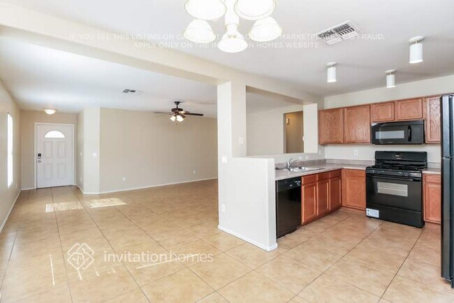 Building Photo - 6050 W Pueblo Ave