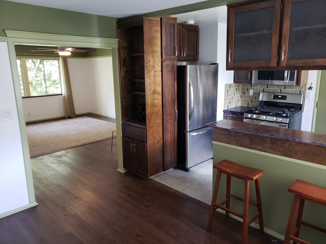 View of kitchen and living area - 5850 Bowcroft St