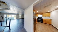 Located in Lauderhill, Florida, this two-story, 3-bedroom, 4-bathroom home offers a well-organized layout spread across two floors. The entry level welcomes you with large dark tile flooring that extends through the hallway and into the open-concept living and dining area. Sliding glass doors in the living room fill the space with natural light and provide access to a private balcony. Adjacent to the living area, the kitchen features warm wood cabinetry, granite countertops, a white subway tile backsplash, recessed lighting, and black appliances including an electric range with overhead ventilation. A staircase with a sleek metal railing connects the two floors. The upper level hosts the bedrooms, including a generously sized primary bedroom, each with light tile flooring and ample natural light from well-positioned windows. Seven closets are distributed throughout the home, providing exceptional storage capacity. The four bathrooms are clean and functional, featuring white tiled tub-shower combinations and tile flooring. Textured ceilings are present throughout both levels. With a practical layout, abundant storage, and a private balcony, this home offers comfortable multi-level living in a convenient South Florida location.