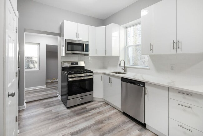 Photo - Renovated 4-Bedroom Home with Modern Finishes