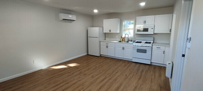kitchen/living room with cooling and heating wall unit - 1213 N 3rd St