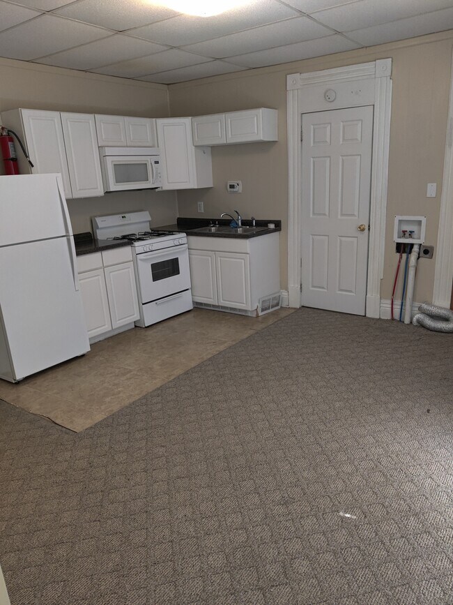 Full kitchen with Fridge and Stove. Washer and dryer hook up - 1407 S Shelby St