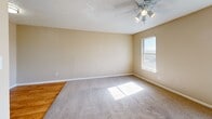 Located at 1101 Rutland Dr in Austin, TX, this single-story home offers four bedrooms and two full bathrooms within a practical and efficient layout. The living area features neutral-toned walls, plush carpet flooring, a textured ceiling, and a ceiling fan, creating a comfortable and well-lit space. Natural light flows in through multiple windows throughout the home.

The galley-style kitchen is equipped with gray cabinetry, light countertops, a double-basin sink, a gas range, a refrigerator, and a microwave, all set atop hardwood-style flooring that extends into the hallway area.

Each of the four bedrooms is carpeted and features ceiling fans and windows that allow natural light and outdoor views. The spacious primary bedroom includes a large sliding-door closet. Additional bedrooms are similarly appointed with closet space and ample natural light.

Both bathrooms include a full tub/shower combination, vanity with storage cabinetry, and hardwood-style flooring, maintaining a clean and functional aesthetic consistent throughout the home.

A connecting hallway ties all rooms together efficiently, making this a well-organized single-floor home well-suited for a variety of living arrangements in the heart of Austin.