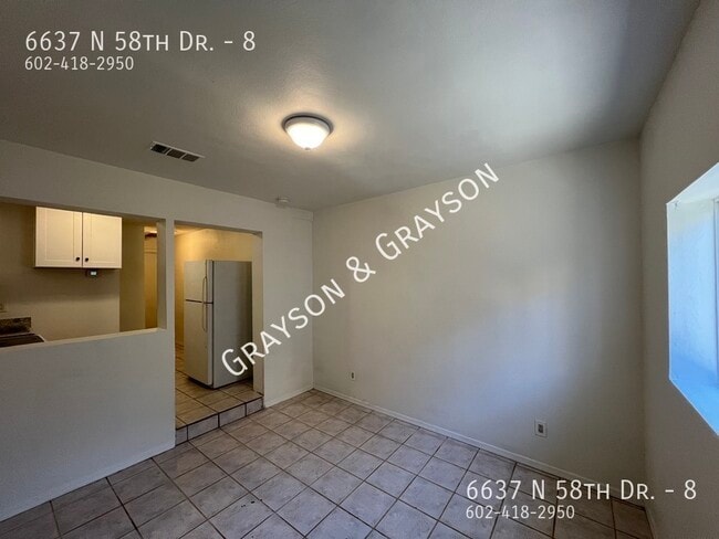 Building Photo - 6637 N 58th Dr