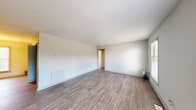 Located on Briarcliff Road NE in Atlanta's 30329 corridor, this single-story, one-bedroom, one-bathroom unit offers a practical and well-organized layout across a comfortable footprint. The living area features durable wood-look plank flooring, neutral white walls, and a built-in floor vent, creating a clean, move-in-ready environment. Natural light enters through blinds-fitted windows, enhancing the open feel of the space.

The kitchen is equipped with dark cabinetry, a tile backsplash, and a full suite of stainless steel appliances, including a range, microwave, and dishwasher. An adjacent dining area benefits from a large window and a pendant light fixture overhead. A louvered pantry closet provides additional storage alongside the refrigerator.

The bedroom is generously sized, finished with plush carpet, a ceiling fan with light fixture, and two windows offering outdoor views. A dedicated closet with a rod and shelving connects directly off the bedroom. The hallway leads to the full bathroom, which includes a dark-cabineted vanity with a white countertop, tile-surround tub/shower combination, and wood-look flooring throughout.