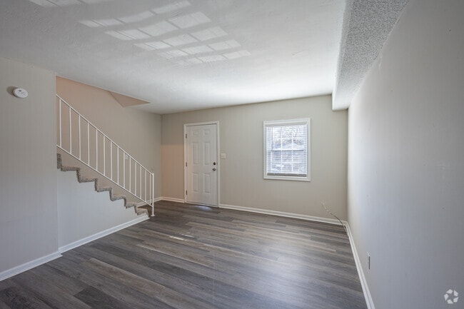 2BR, 1.5BA - 965SF Living Room, Front Door - Ivey Ridge Townhomes