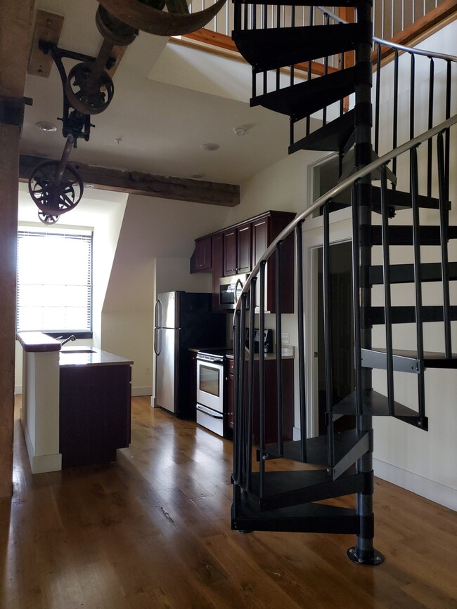 Kitchen and Spiral Stairs to Loft - Piedmont Flour Mill Lofts