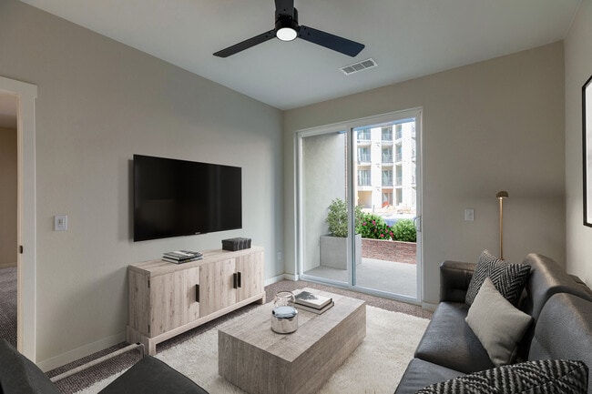 Cozy Living Room with Balcony Access and Neutral Wood Accents - Hensley at The District