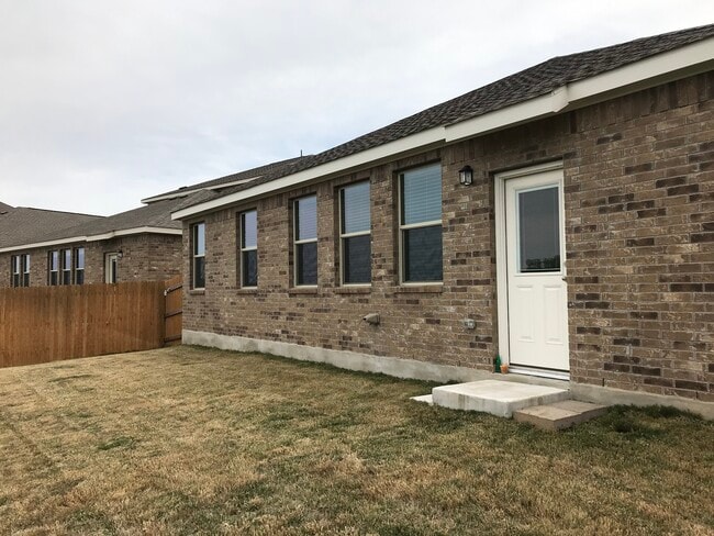 The back of the house with privacy fence - 1313 Eagle Ridge Trl