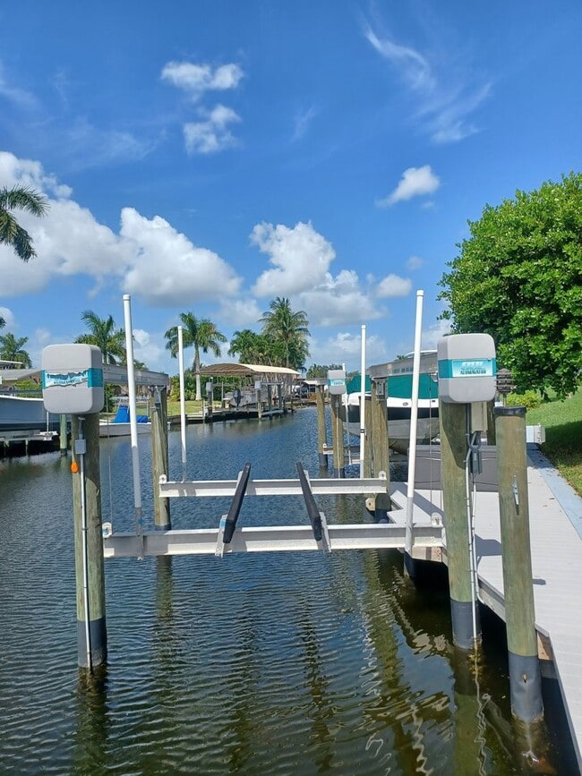 Building Photo - UPGRADED WATERFRONT END UNIT 3 BR / 2 BA Home With BOAT LIFT/ DOCK & OUTSTANDING VIEWS
