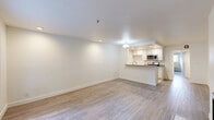 Located in the heart of Hollywood at 6619 Leland Way, this 1-bedroom, 1-bathroom residence offers a thoughtfully designed layout with modern finishes throughout. The open-concept living area is bright and airy, featuring light wood-tone flooring, recessed lighting, and a clean white palette that maximizes the sense of space. A standout feature is the fireplace set against a crisp white surround, adding warmth and character to the living room. A large window near the front entry allows natural light to flow in, offering a view of lush outdoor greenery.

The kitchen is efficiently laid out with white cabinetry, quartz-style countertops, a peninsula with bar seating, and stainless steel appliances including a gas range and over-the-range microwave. Light tile flooring ties the kitchen together seamlessly.

The spacious bedroom features wood-tone flooring, a window providing natural light, a wall-mounted A/C unit, and a generously sized closet with mirrored sliding doors and built-in shelving for ample storage.

The bathroom is well-finished with tile flooring, large-format wall tiles in the tub/shower surround, a white vanity with a quartz countertop, and a recessed light. A connecting hallway completes the functional floor plan of this stylish Los Angeles residence.