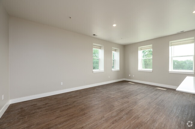 2BR, 2.5BA - 1,561SF - Living Room - The Assumption on Blaine
