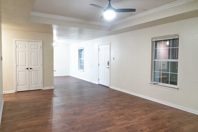 Living room (from the other side) that opens up to the dining room. Closet contains washer and dryer - 1231 Wood Ave