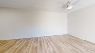Located at 8250 E Golf Links Rd in Tucson, Arizona, this 2-bedroom, 2-bathroom single-floor home offers a clean, well-organized layout designed for comfortable everyday living. Light wood-style flooring runs throughout the entire space, creating a bright and cohesive aesthetic that ties each room together.

The combined kitchen and living area serves as the heart of the home. The kitchen features white cabinetry, granite-style countertops, a cooktop, stainless steel refrigerator, and a pass-through open to the living area — maximizing both function and connectivity. The living room is bathed in natural light and opens directly to a private outdoor patio through sliding glass doors, offering a seamless indoor-outdoor connection.

Both bedrooms are well-proportioned with the same warm wood-style flooring, ceiling fans with lighting, and ample closet space with panel-style doors. The primary bedroom provides a comfortable retreat, while the second bedroom includes a window with blinds that lets in natural light. Hallways connect the rooms efficiently throughout the layout.

Each of the two bathrooms is finished with white tile surrounds, full-size soaking tubs with showerheads, and clean, simple fixtures. Textured ceilings are present throughout the home, adding a subtle architectural detail consistent across all rooms.