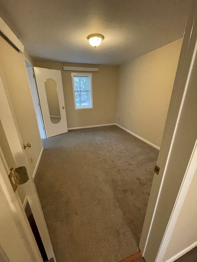 bedroom with walk in closet - 212 4th Ave NE
