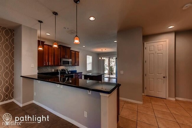 Building Photo - 4 br, 2.5 bath House - 5100 Millennia Gree...