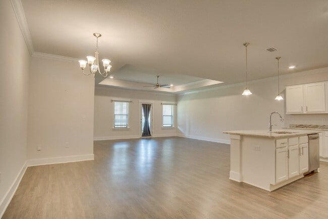 Building Photo - Spacious Cantonment Townhome with Open Layout, 2-Car Garage, Covered Back Porch & Easy Access to ...