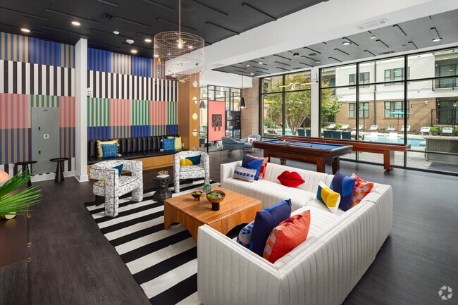 Resident Social Space Featuring Lounge Seating, Billiards, and Colorful Décor - 675 N. Highland