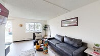 Located at 1920 NE Terre View Dr in Pullman, WA, this single-floor unit offers three bedrooms and three bathrooms within a well-organized layout. The living room provides a comfortable gathering space with light wood-style flooring, a textured ceiling, a baseboard heating system, and a window that brings in natural light with views of the surrounding neighborhood. The kitchen and dining area are efficiently combined, featuring dark countertops, white cabinetry, a stainless steel range, and room for a dining table — a practical setup for everyday living. Each of the three bedrooms is designed with simplicity in mind, featuring neutral walls, wood-style flooring, and windows that allow natural light to filter in. The primary bedroom offers a cozy, functional space, while the additional bedrooms provide comparable comfort. The three bathrooms are clean and functional, each equipped with a shower or tub-shower combination, a vanity with dark countertops, and overhead cabinetry for storage. Two closets and a dedicated utility room add practical storage and functionality throughout. The unit also includes a hallway connecting the rooms in a straightforward and efficient floor plan, making this a well-suited residence in the Pullman area.