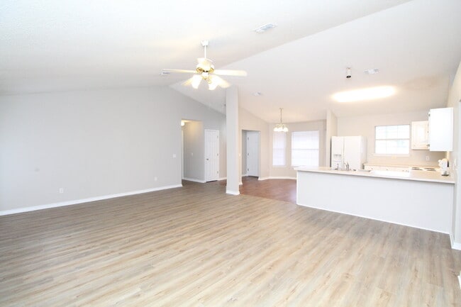 Building Photo - 3BR/2BA Brick Home with Vaulted Ceilings, Open Living Areas, 2-Car Garage & Fenced Backyard Near ...